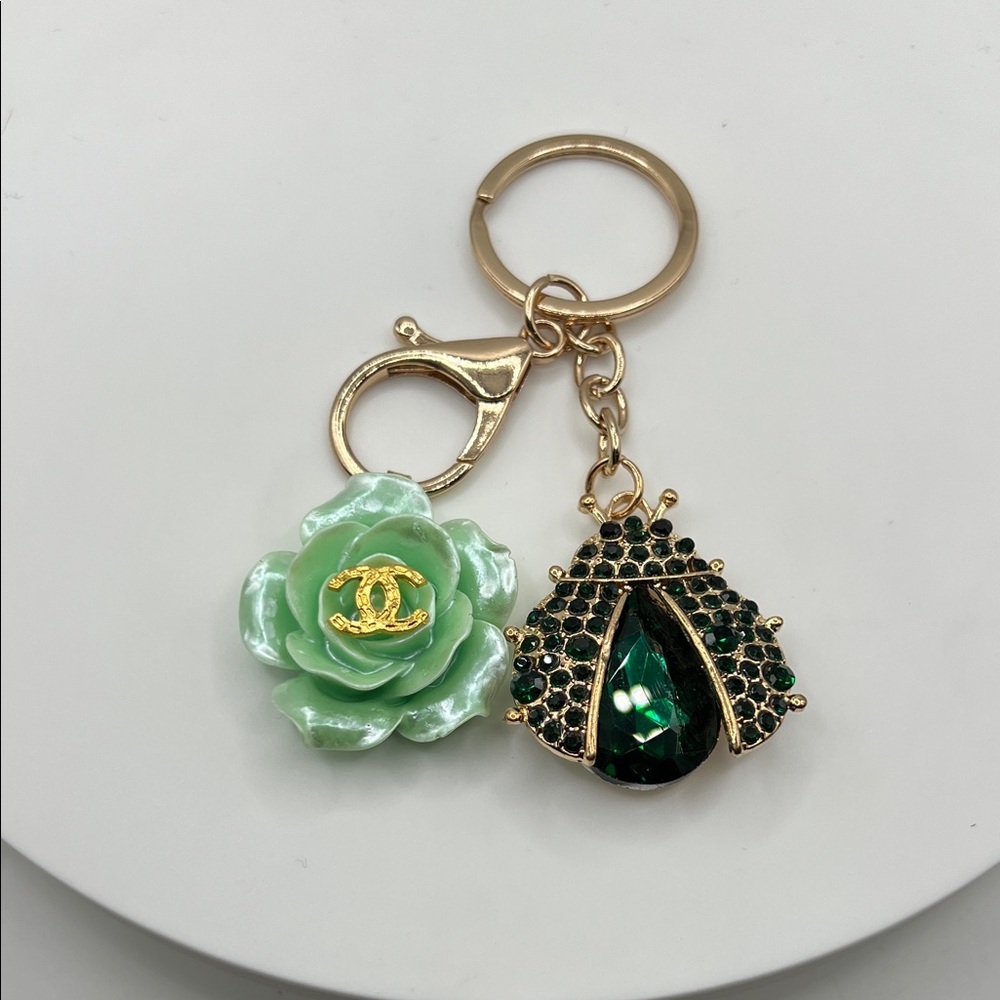1464. Designer Green CC Stamped Flower Charm with Ladybug Keychain/Bag Charm.